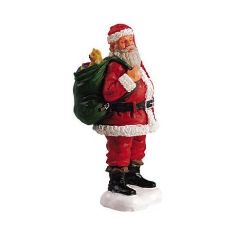 Vista frontale il Babbo Natale che controlla la sua lista | Foto Gratis