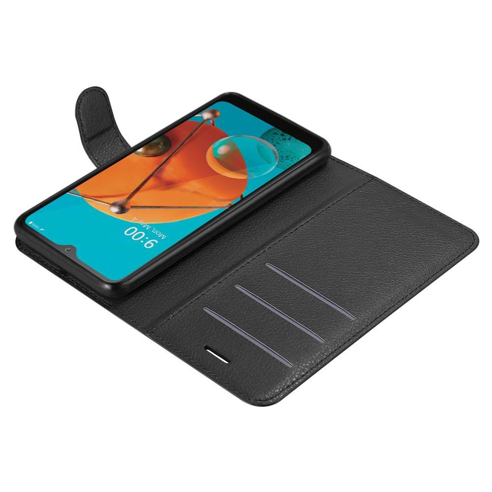 Custodia Compatibile Con Lg Kq51 In Nero Carbone - Coperchio Protettiva Con Chiusura Magnetica, Funzione Stand E Tasca Per Le Carte - Foto 8